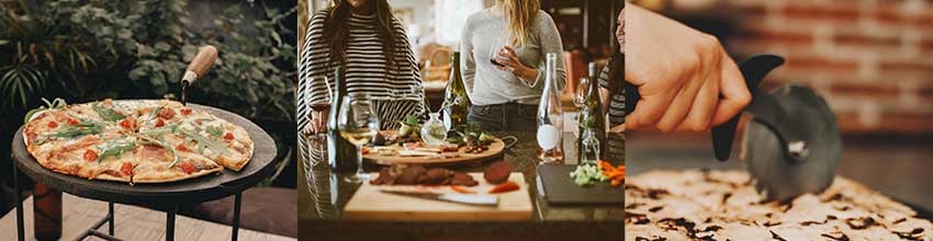 Pizza serverad med stil i ett socialt och elegant miljö med pizzaskärare, vin och uppläggning för en informell middag eller pizzafest.